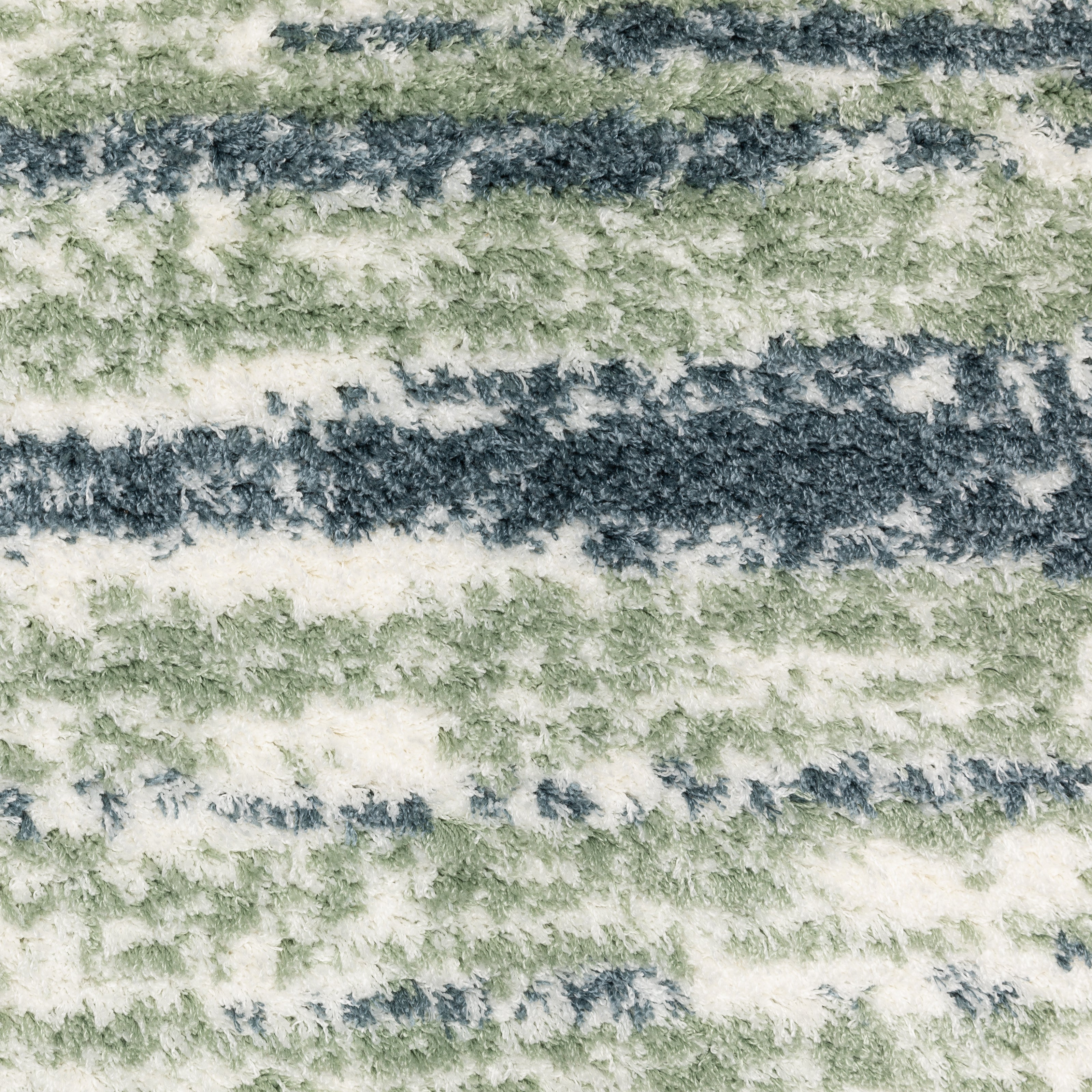 Striped area rug with green, navy and cream horizontal bands in textured weave