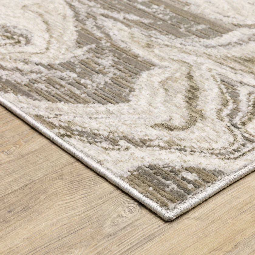 Beige and taupe marbled swirl pattern area rug with textured finish