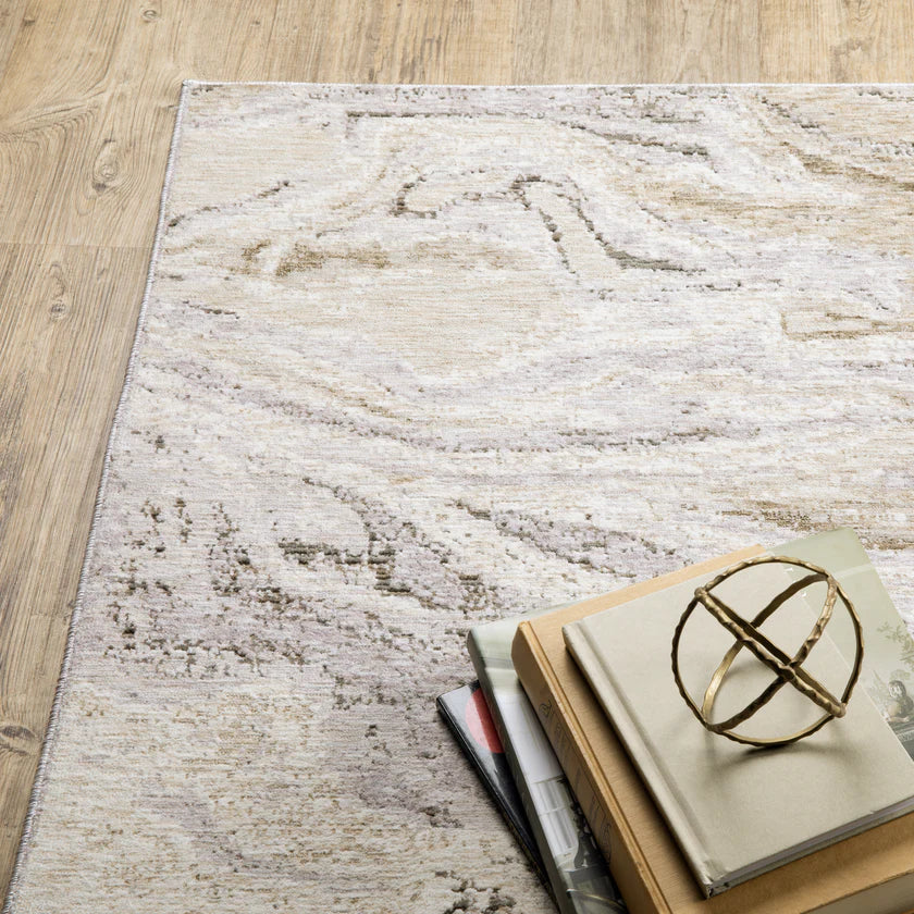 Beige and taupe marbled swirl pattern area rug with textured finish
