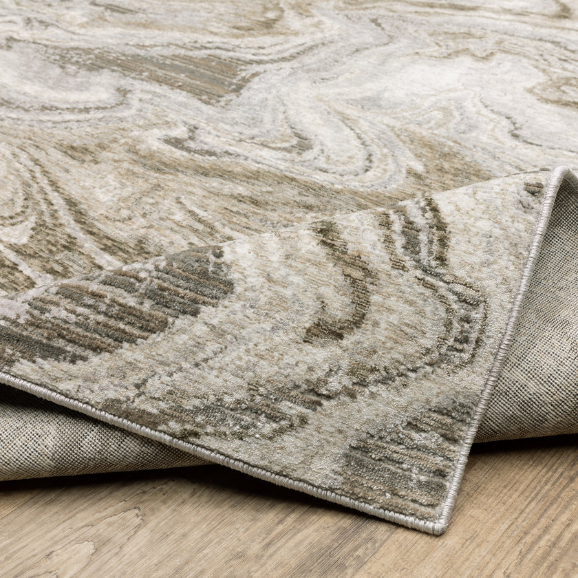 Beige and taupe marbled swirl pattern area rug with textured finish