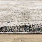 Vintage distressed grey and cream rug with abstract mottled texture pattern