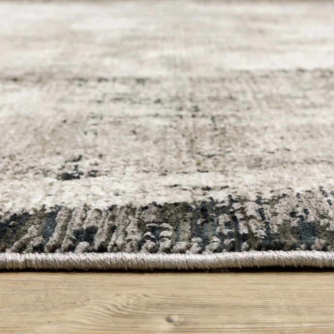 Vintage distressed grey and cream rug with abstract mottled texture pattern
