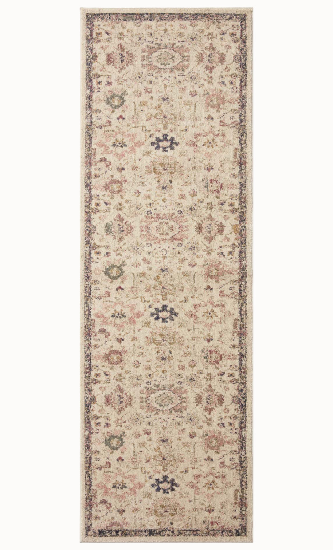 Vintage-style area rug with cream base, intricate geometric and floral patterns in rust and blue tones