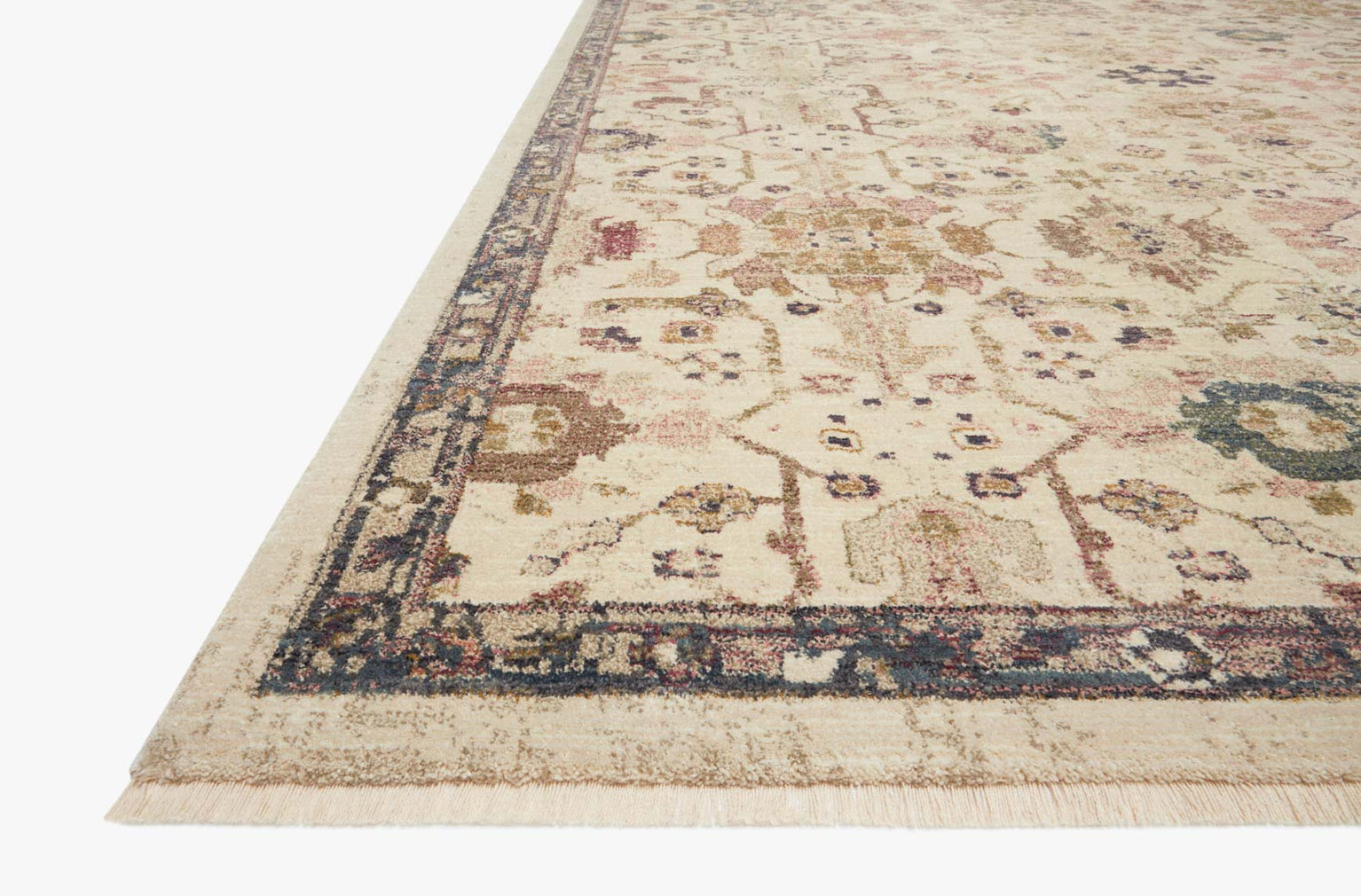 Vintage-style area rug with cream base, intricate geometric and floral patterns in rust and blue tones