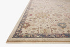Vintage-style area rug with cream base, intricate geometric and floral patterns in rust and blue tones