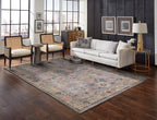 Gray traditional rug with pink floral motifs and ornate border design